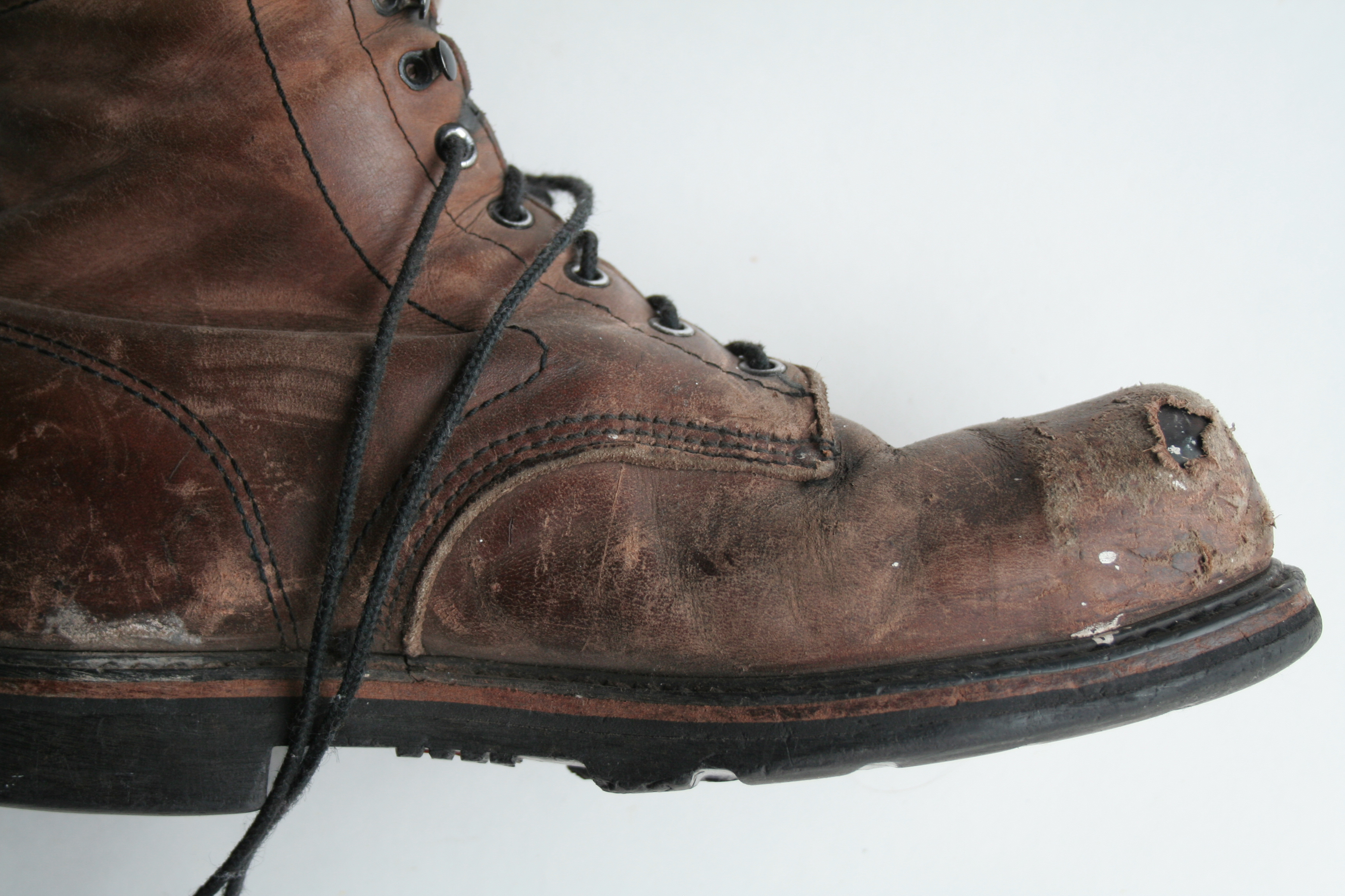 worn out steel toe boots